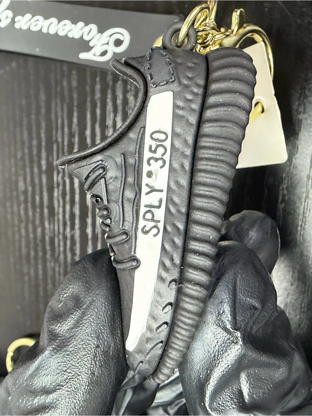 Black Keychain with Gold Hardware and Sneaker Charm
